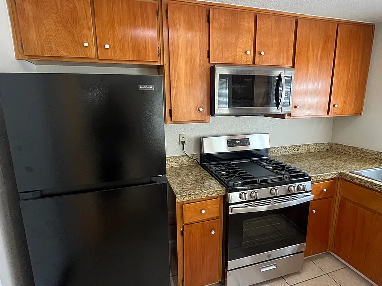 Kitchen with New Fridge and New Gas Stove