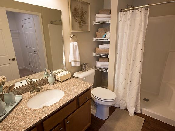 Master bathroom with granite countertops and walk-in shower