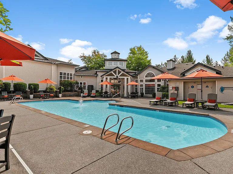 Sparkling outdoor pool with sundeck