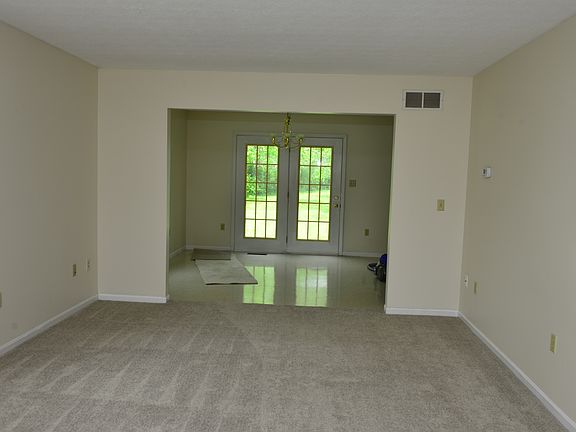 View from Front Entrance to Open Area Dining Room and Kitchen
