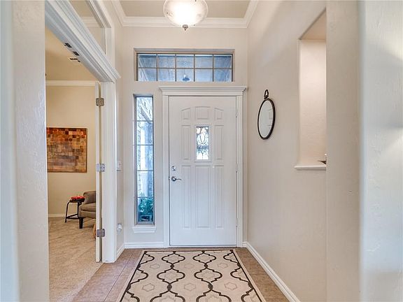 Entry way with the office french doors right inside.