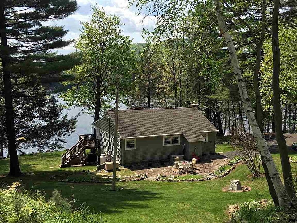 Private & peaceful lakeside setting on 3/4 acres
