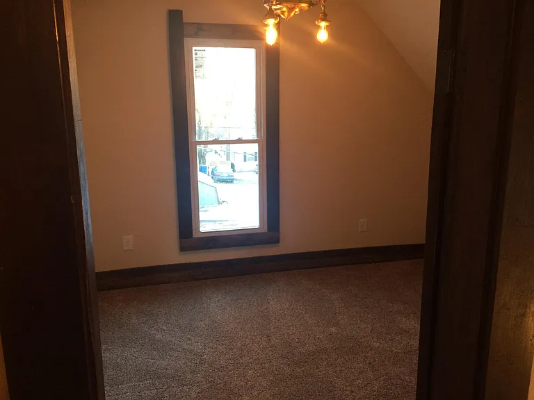 3rd upstairs bedroom, this one has the largest closet, with a 3 bulb fixture, antique art novue'