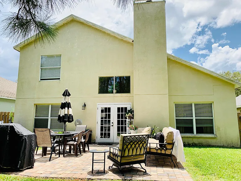 Large Paved Deck with many outdoor furnitures