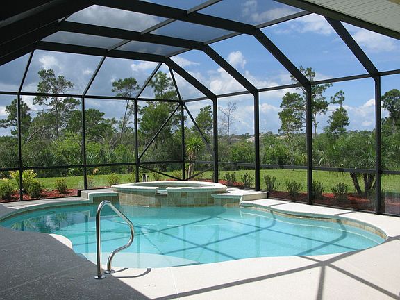 Heated self-leveling saltwater pool with beach area & spa