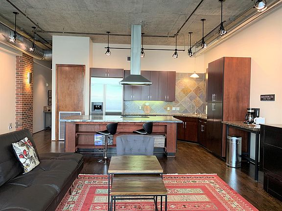 Open space for entertainment. Nice, comfortable Eurolounger/sofa and Queen-size Murphy bed for overnight guests. Huge 75" flat s