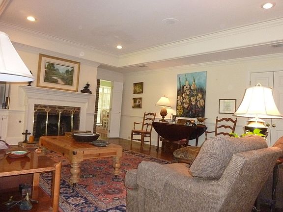 Den has fireplace and built-ins