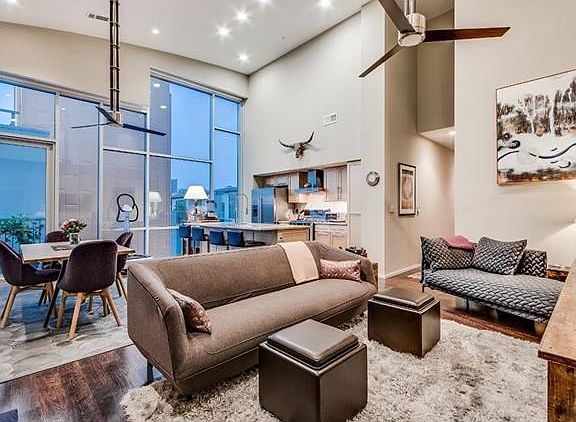 16' barrel-vaulted ceilings and walls of windows add incredible architectural detail.