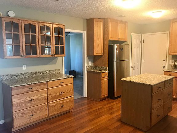 Kitchen with stainless steel refrigerator