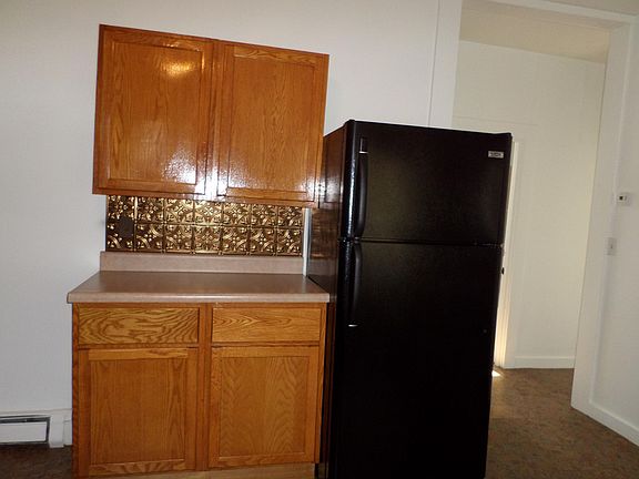 Kitchen storage with view in to hall to bedrooms. Lots of storage in this 1st floor 2 bedroom apartment