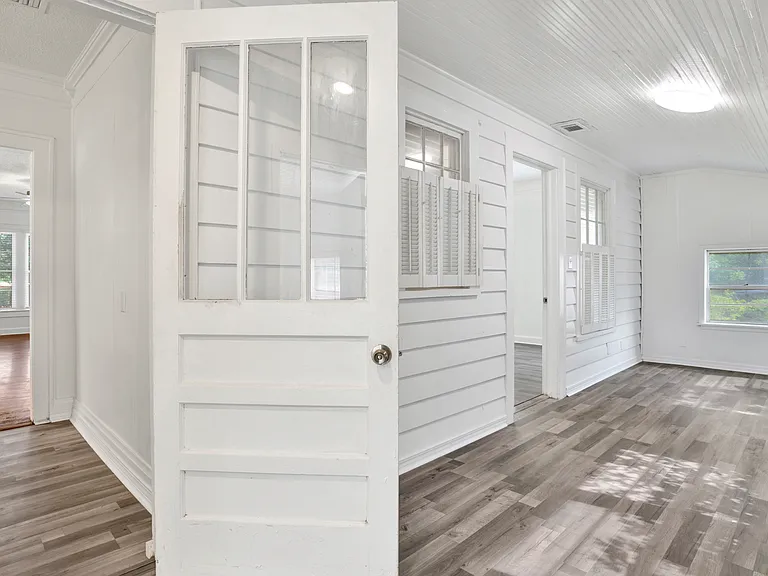 Den to the right, kitchen to the left.