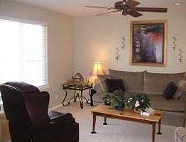 Cozy Family room with ceiling fan