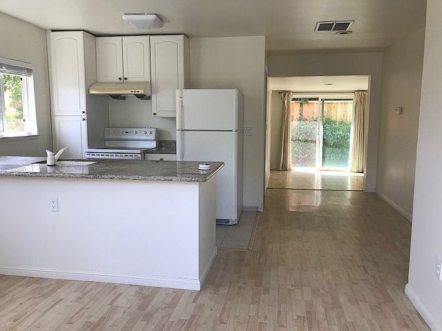 via entrance, common living area, kitchen