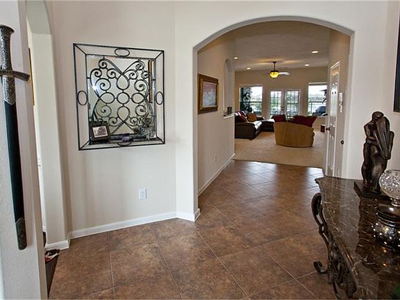 Entry way has upgraded tile and is very open