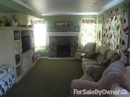 Family Room : Family room, built-in media, sitting areas, recessed lighting, stone fireplace.