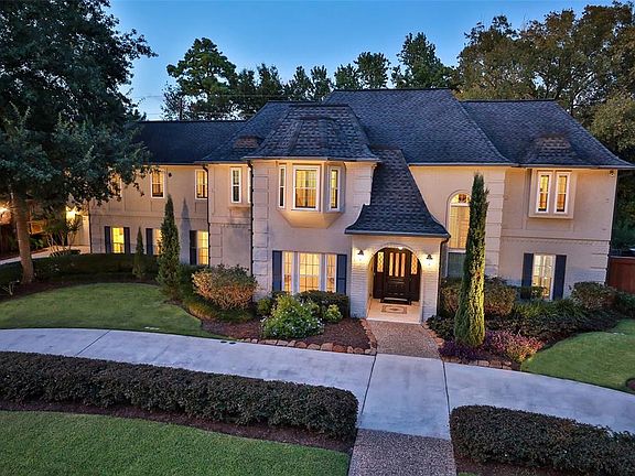 CIRCULAR DRIVEWAY ADDS COMFORTABLE EASE OF LIVING - 15926 Stornoway is the epitome of beauty and style. French roof line design compliments the exterior curb appeal. Extraordinary architectural details with arched door entry, brick quoins and grey pa