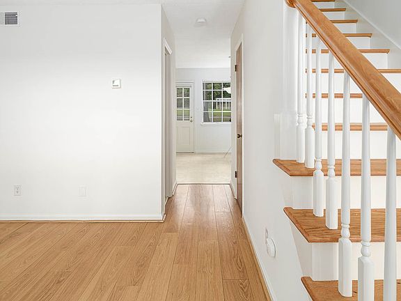 living room flows to kitchen/dining area