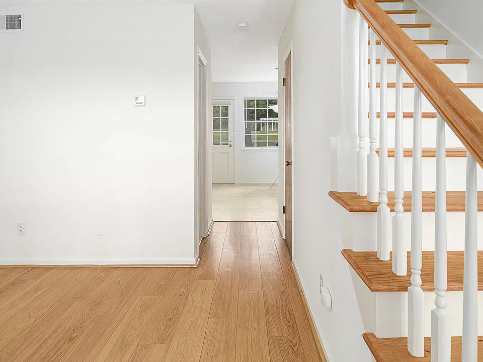 living room flows to kitchen/dining area