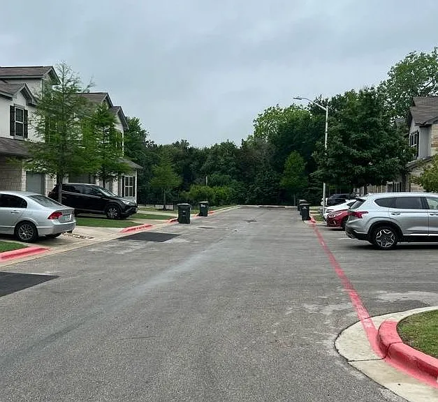View to the right of the home, extra parking in view