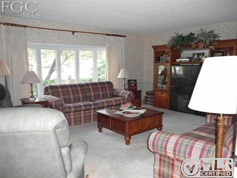 large living room with bay window