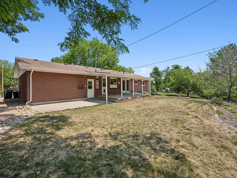 Huge backyard with covered porch w entertaining lights