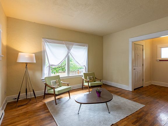 Living room with hardwood floors and picture window