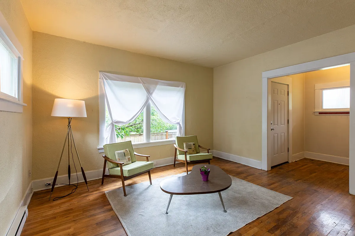 Living room with hardwood floors and picture window - 2544 15th Ave W