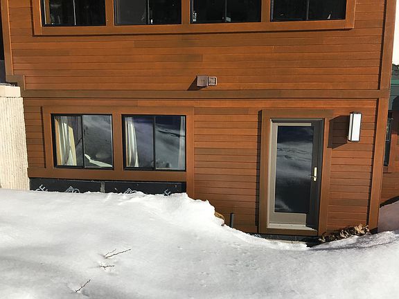 Door to kitchen; Bedroom windows.