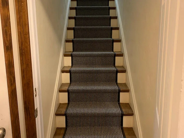 Steps leading to the apartment from entryway.