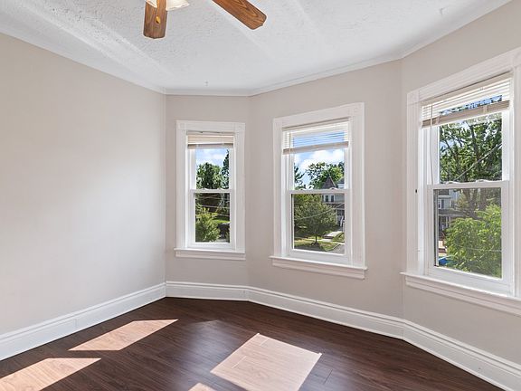 Charming living room with new windows, freshly painted and new floors. Lots of natural light.