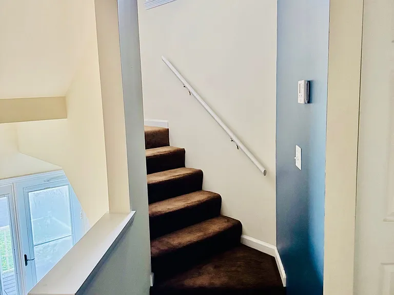 Stairs leading to the two bedrooms on second floor