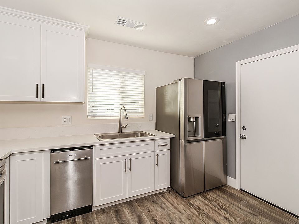 Updated Kitchen with Quartz Counter tops, high end appliances, LVP flooring, custom cabinets to the ceiling with soft close cabinets.