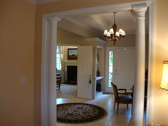 Notice Pillars leading to living room.
