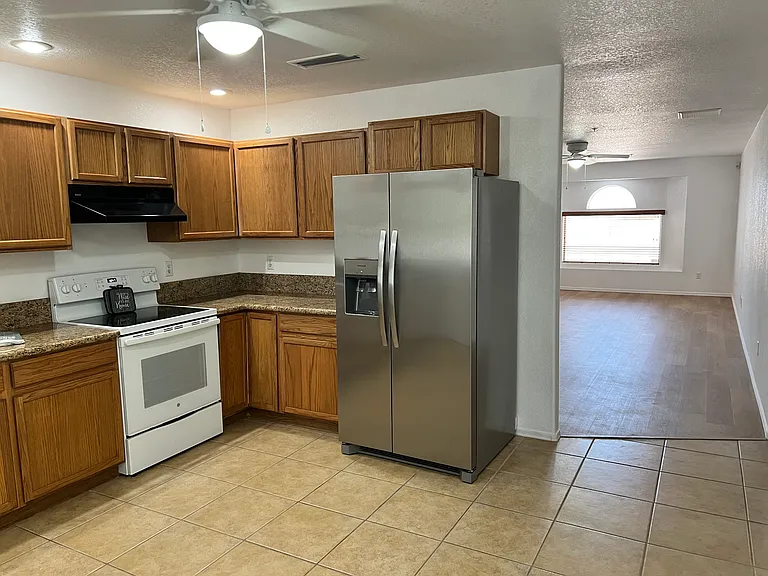 Kitchen with view into living room