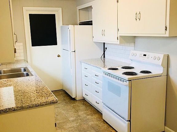 kitchen with granite counters abd vinyl flooring