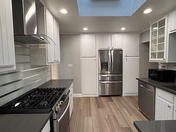 Updated kitchen with Gas burner and stainless steel appliances