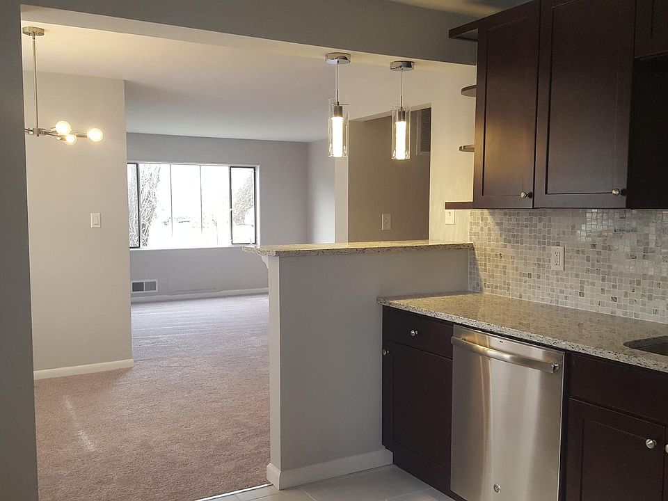 View of kitchen, dining area and living room from Sunroom