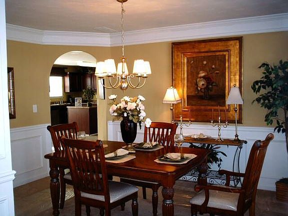THE DECORATED MODEL-Outstanding arched entry way frames the Formal Dining Room which is standard.