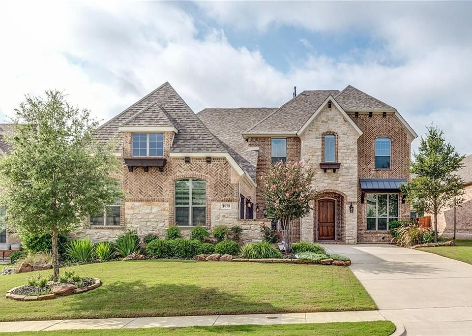 This custom built Drees home is located in the heart of Keller within a short walk of Keller High School!