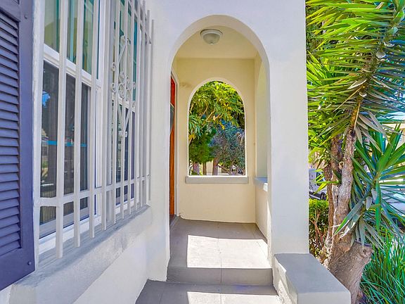 Sunny porch with arched doorway and window