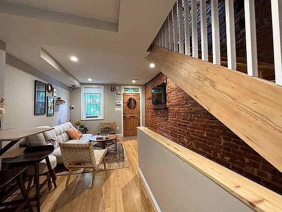 Exposed brick and wood beam staircase