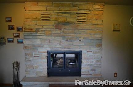 Den/office
						:
						Gorgeous Stone fireplace in den/office also has patio doors for ample lighting