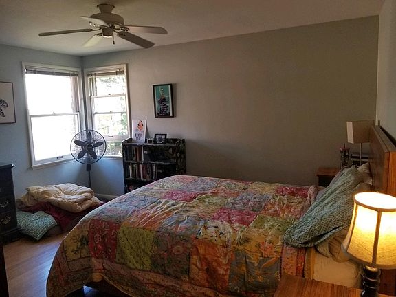 Large bedroom faces east and south. Furniture not included