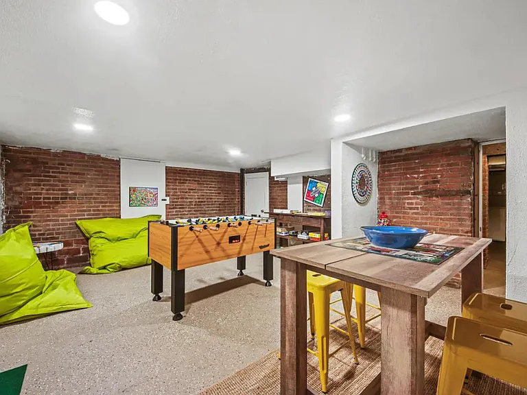 Shared Game Room Space in Basement (Laundry attached to this space)