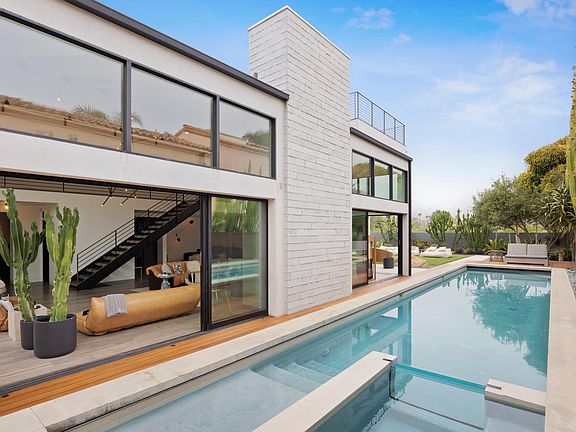Large glass sliders open up for the perfect inside-outside space.