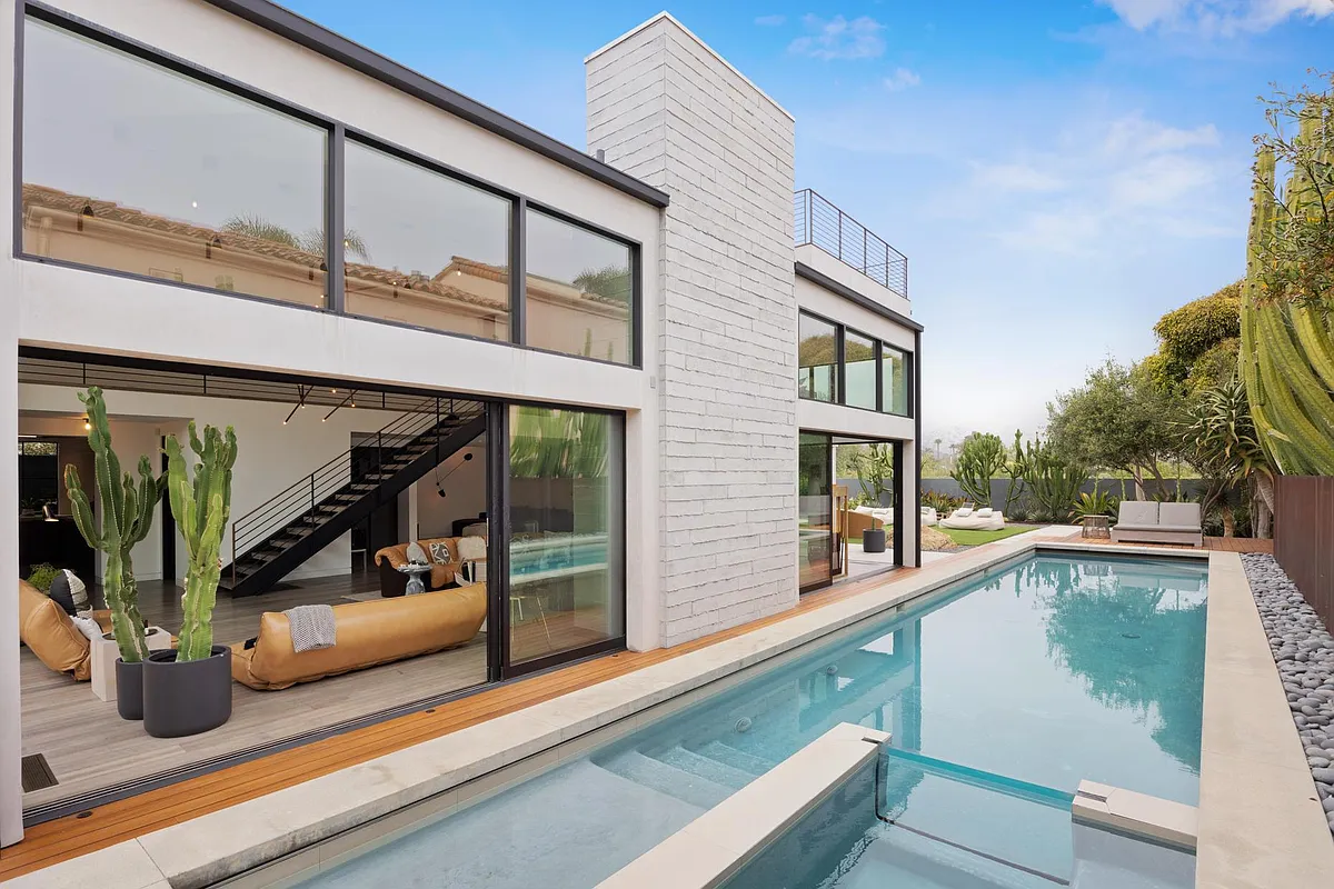 Large glass sliders open up for the perfect inside-outside space. - 23401 Malibu Colony Rd