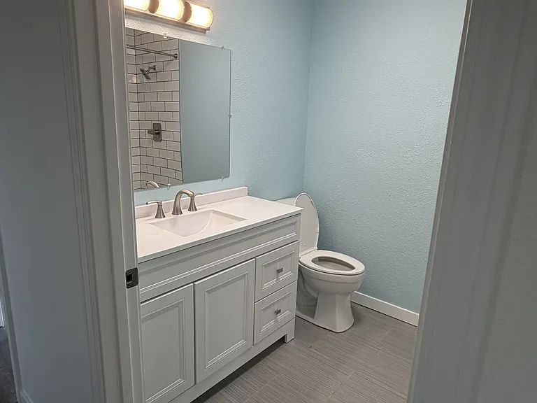 Water closet with a brand new toilet.