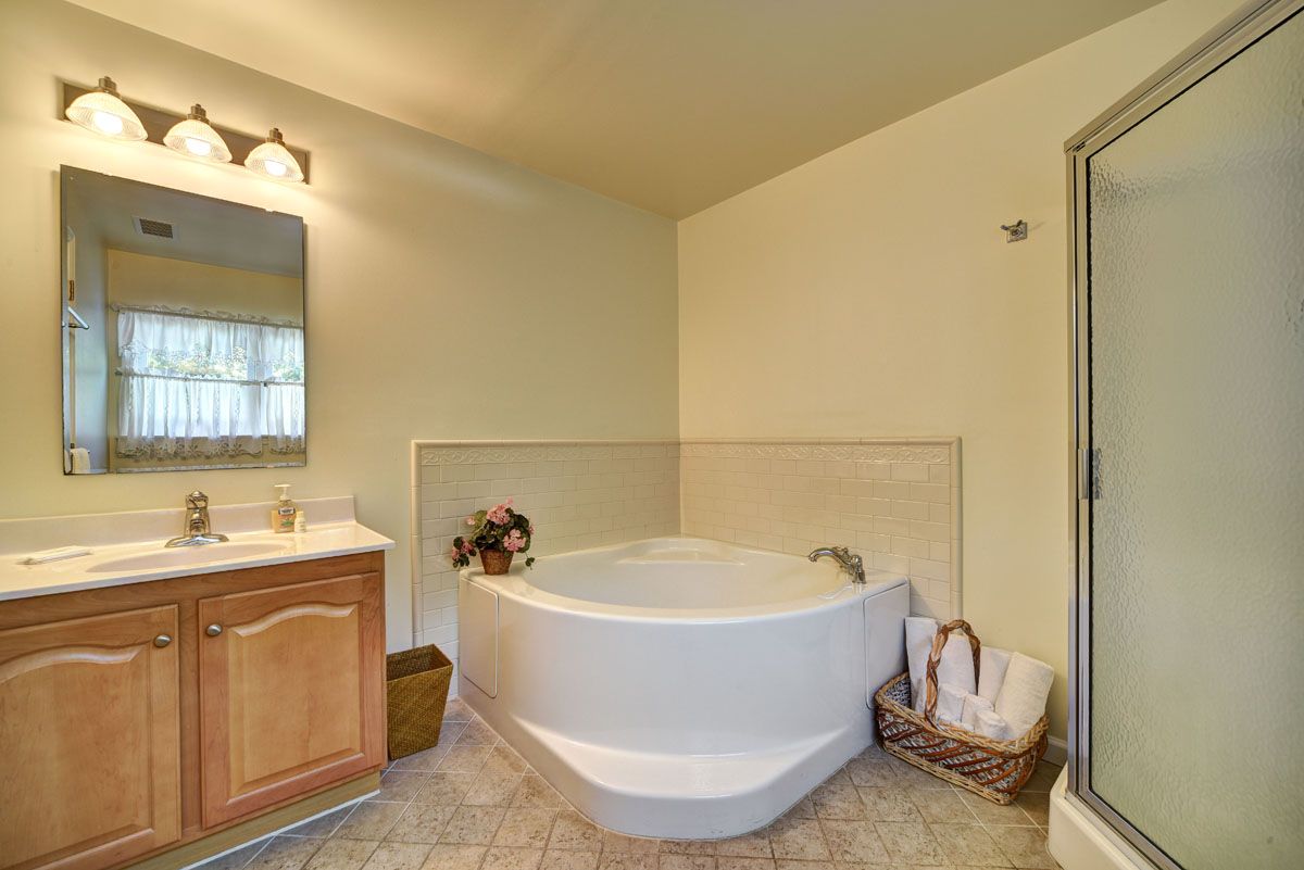  Master bathroom with soaking tub and step in shower enclosure