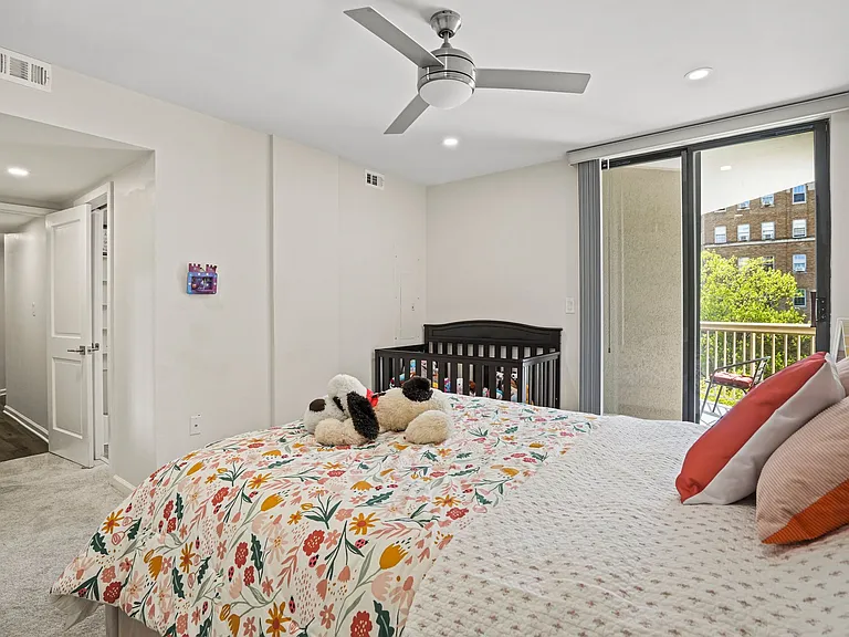 Bright, spacious bedroom with direct balcony access, ample closet space and expansive natural light