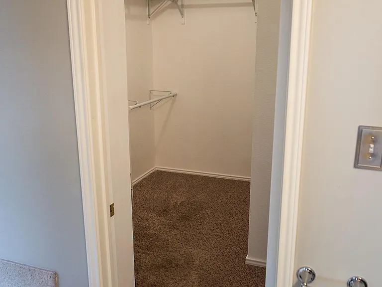 Private En-Suite Bathroom Featuring a Double Vanity, Garden Tub, and Separate Shower, Plus an Oversized Walk-In Closet.